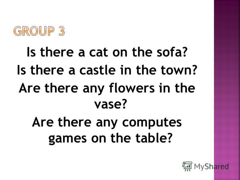 Is there a cat on the sofa? Is there a castle in the town? Are there any flowers in the vase? Are there any computes games on the table?