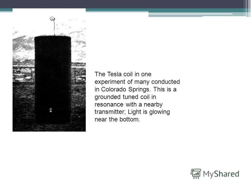 The Tesla coil in one experiment of many conducted in Colorado Springs. This is a grounded tuned coil in resonance with a nearby transmitter; Light is glowing near the bottom.